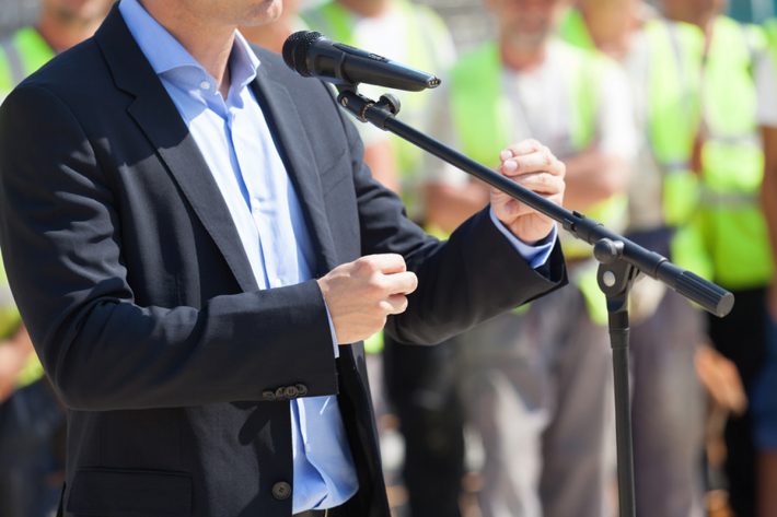 Businessman or politician is giving a speech